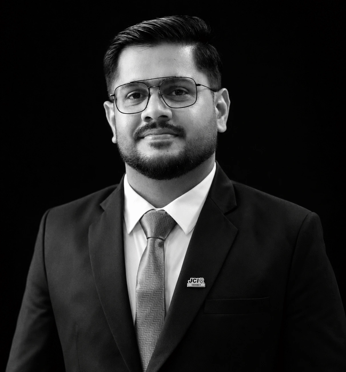 Rashid U, founder of Digibeat, in a suit looking to the side